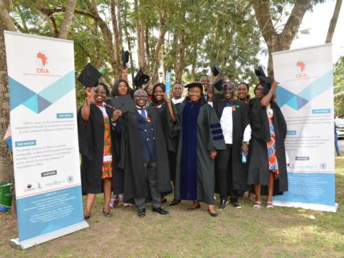 graduants holding hats high